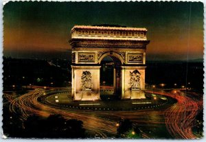 Place de l'Etoile at night and the triumphal arch illuminated - Paris, France