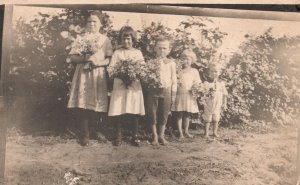 Vintage Postcard Young Children in White Dress Holding Flowers Portrait RPPC