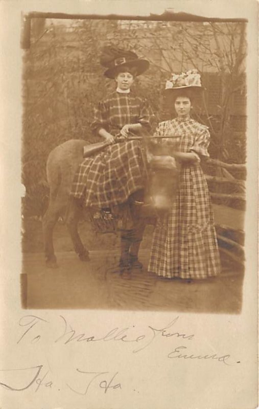 Girls wearing hats Writing on back writing on front