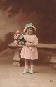 Little girl with flowers Child, People Photo Writing on back 