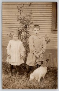 RPPC Adorable Children on Lawn with Sweet Jack Russell Terrier Dog Postcard E26