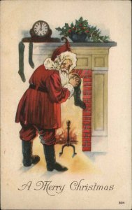 Christmas Santa Claus Stuffs Stockings Fireplace c1900s-10s Postcard