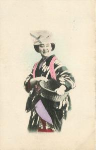 C-1910 Japan hand colored Ethnic Dress Basket Woman postcard 7750