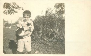 Postcard RPPC C-1910 Boy holding cats rural 23-5702