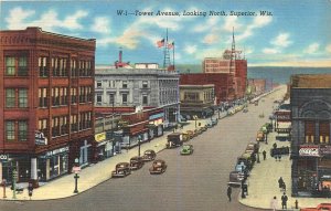 Postcard 1940s Wisconsin Superior Tower Avenue autos flag Coca Cola WI24-2921