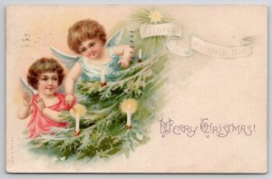 Christmas Cherubs Lighting The Tree Postcard U26