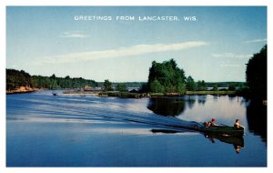 Postcard WI Greetings from Lancaster, Wis. - People in motor boat