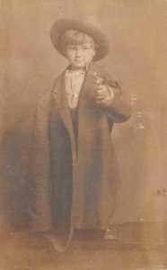 RPPC CHILD OVERCOAT HAT CAP GUN PENNSYLVANIA STUDIO REAL PHOTO POSTCARD (1920s)