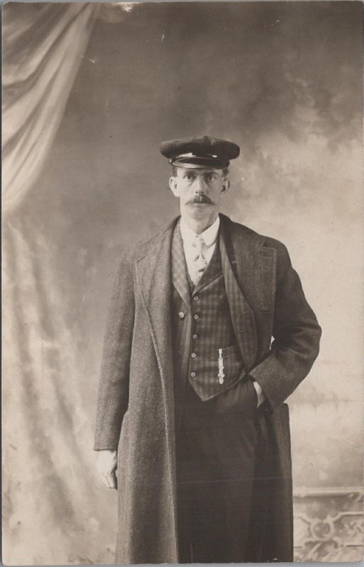 RPPC Postcard Man Wearing Long Coat and Hat Hand in Pocket