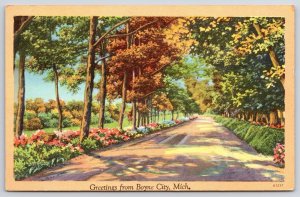 Greetings From Boyne City Michigan MI Scenic Home Road Flower Garden Postcard