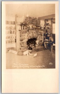 Vtg Wilmington VT Boys Reading In Front of Fireplace Camp Enajerog RPPC Postcard