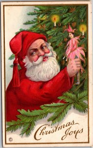 Christmas Joys Satnta holding jester clown doll with tree and candles