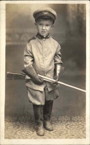 Little Boy in Studio Toy Gun Military Uniform Pins c1910 Real Photo Postcard