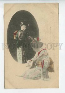 443504 JAPAN Geisha girl in native dress with musical instrument tinted postcard