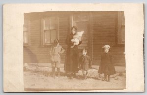 RPPC Lovely May and Her Children Alongside Their House Postcard C26