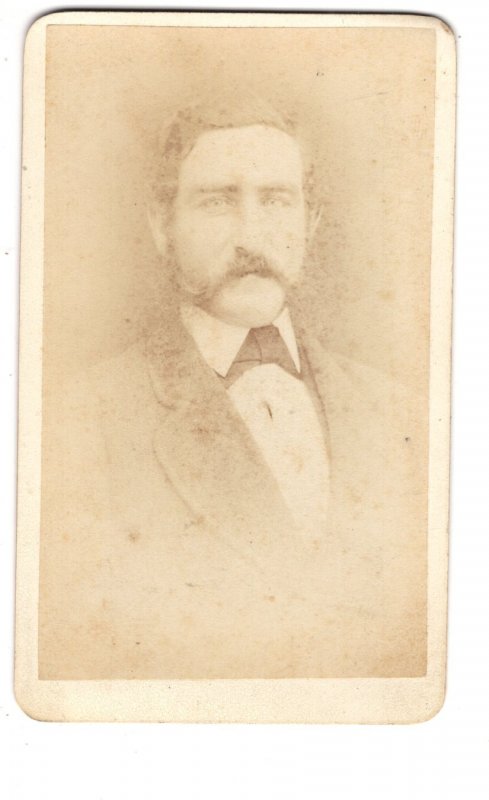 Man in a Small Portrait Photograph