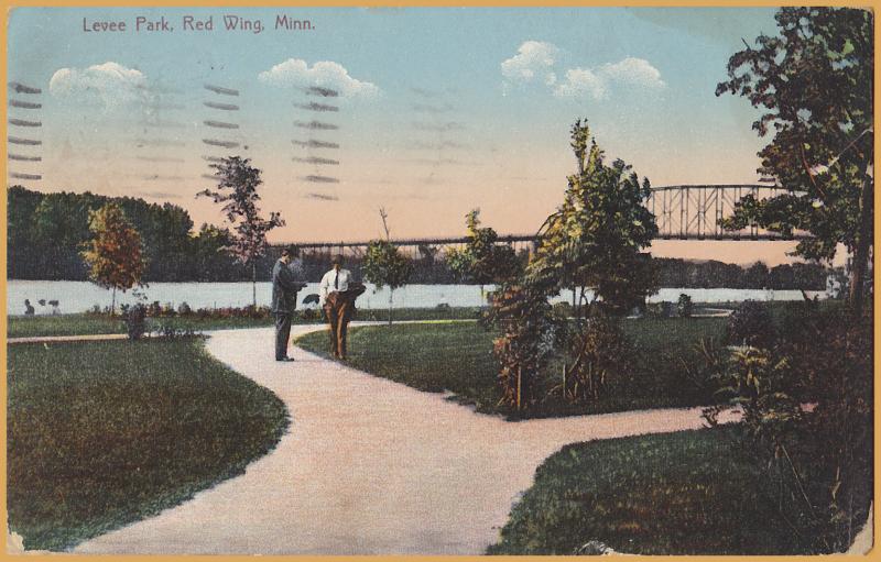 Red Wing, Minn., Levee Park, Bridge in background and men on trail - 1911