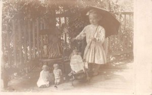 Girl Playing with Dolls Real Photo Vintage Postcard AA70463