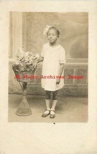 Black Americana, RPPC, Studio Shot, Girl with Hand on Wicker Stand with Flowers