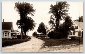 Searsmont Maine~Muddy Intersection~Signs: Camp Wahnahgeesha~Woodbine~RPPC c1930