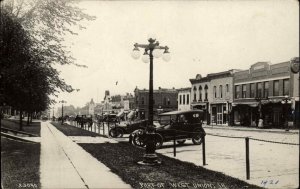 West Union Iowa IA Street Scane Cars & Stores c1915 Real Photo Postcard