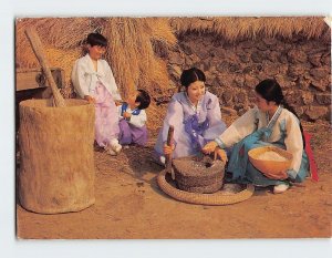 Postcard Woman Grinding Her Grains