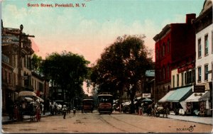 Postcard NY Peekskill South Street Buggies Streetcars Storefronts C.1910 M24