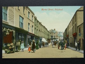 Anglesey HOLYHEAD Animated Market Street showing RAILWAY HOUSE c1904 Postcard