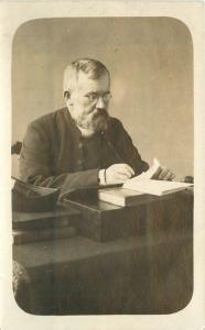 C-1910 Man letter writing Books Desk RPPC real photo postcard 12723