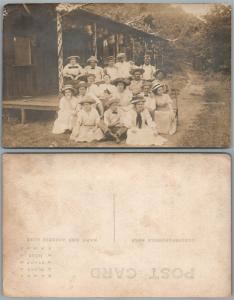 GROUP OF PEOPLE AT REST ANTIQUE REAL PHOTO POSTCARD RPPC LADIES in HATS US FLAGS