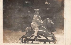 RPPC CHILD ON ROCKING HORSE REAL PHOTO POSTCARD (c. 1910)