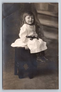 c1909 RPPC Young Girl with Curls Sitting on Stool ANTIQUE Postcard 1456