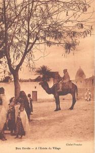 BF18370 a l entree du village bou saada types algeria