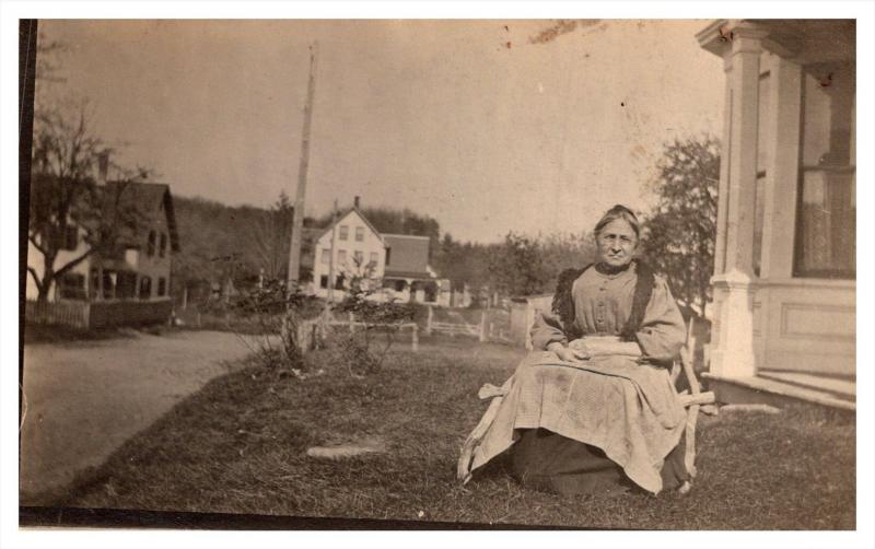 Grandmother sitting Outside Home RPC