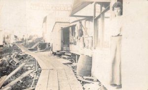 RPPC GENERAL'S MERCHANDISE WOMAN UK ENGLAND REAL PHOTO POSTCARD (c. 1920s)