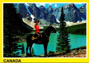 Canada Royal Canadian Mounted Police Set Against Majestic Mountain Background