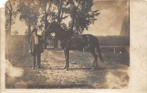 G13/ Castalia Iowa RPPC Postcard 1911 Horse Breeder Man Farm Occupational