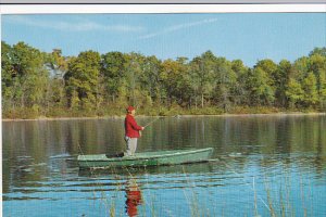 Man Fishing From Boat