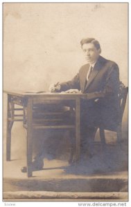 RP; Lawrence W. Thompson at desk in Panama, 1907-1917