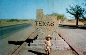 Texas Welcome Marker With Semi-Naked Young Boy WEaring Big Hat and Gun and Ho...