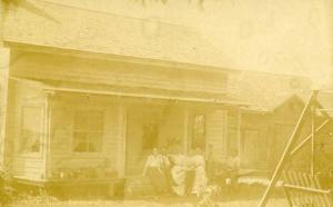 Family in front of House    *RPPC