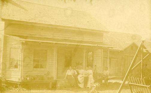 Family in front of House    *RPPC