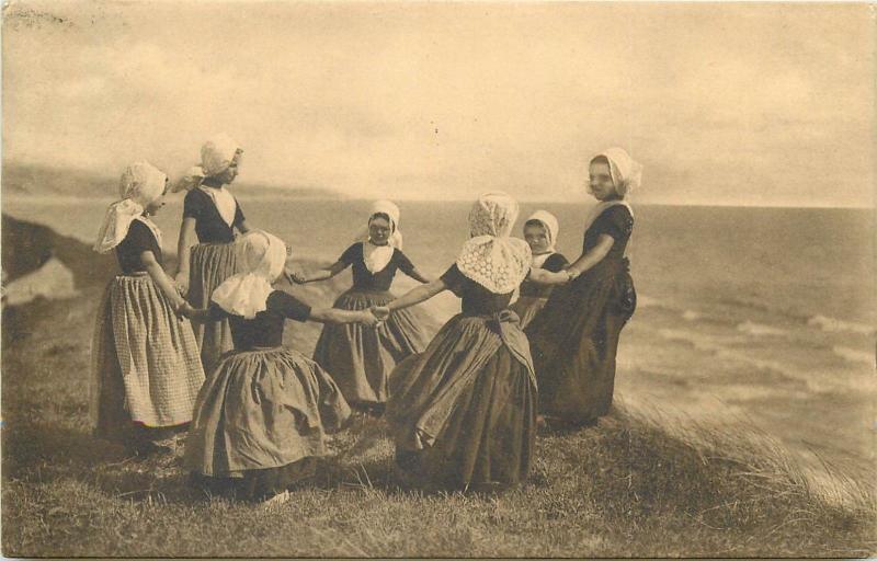 Dutch girls dancing on the sand-hills Zealand folk costumes Netherlands 