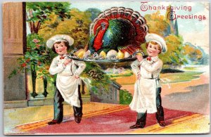 1910's Thanksgiving Greetings Boys Carrying Big Turkey Posted Postcard