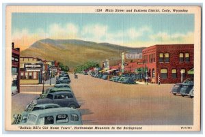 c1940 Main Street Business District Classic Cars Parked Cody Wyoming WY Postcard