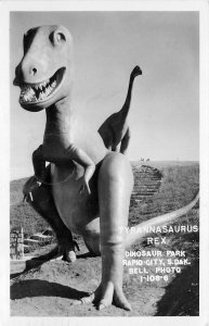 Postcard RPPC 1957 Rapid City South Dakota Tyrannosaurs Rex Park Bell 24-6393