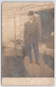 RPPC Handsome Gentleman Derby Hat And Suitcase Under Trellis Postcard Y28