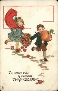 Tuck Thanksgiving Children Little Boy and Girl Basket of Apples c1910 Postcard