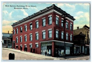 1912 New Aarons Building River Street Roadside Group Of Men Manistee MI Postcard