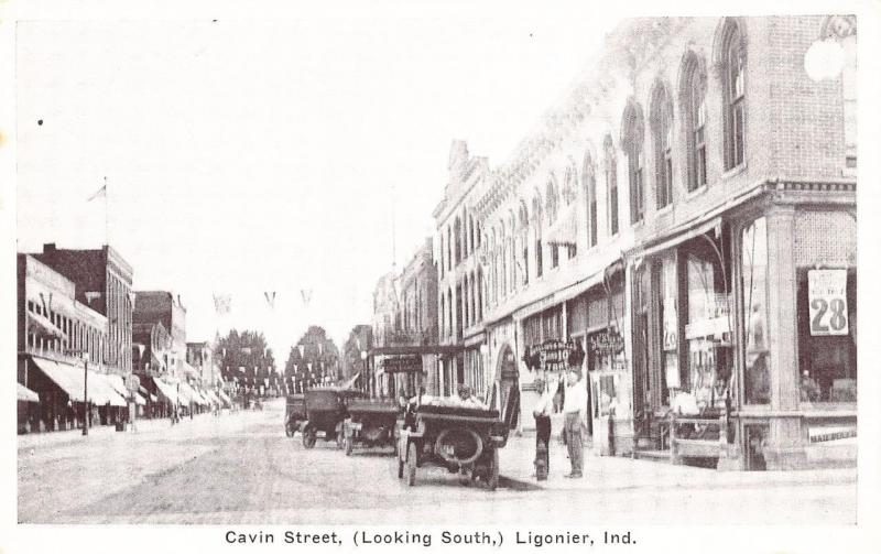 Ligonier IN Cavin Street Business District Storefronts Old Cars Postcard